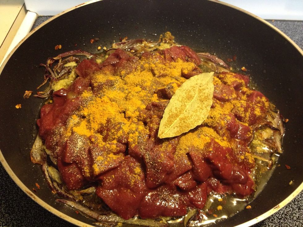 Cook the paste & onions for a quick second. Time for that liver! ...and the spices! The spice amount can be altered according to your taste. Don't forget the salt.