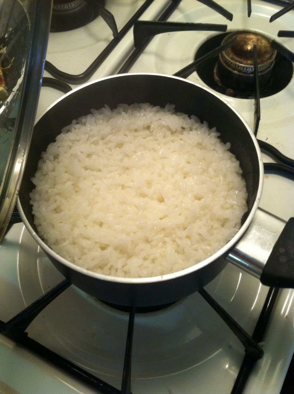 Cook the rice in a small saucepan. Approximately 1 cup of water per cup of rice. Bring water to boil. Add rice allow to boil again. Simmer down to lowest heat setting and cover. Cook for 10-15 mins.