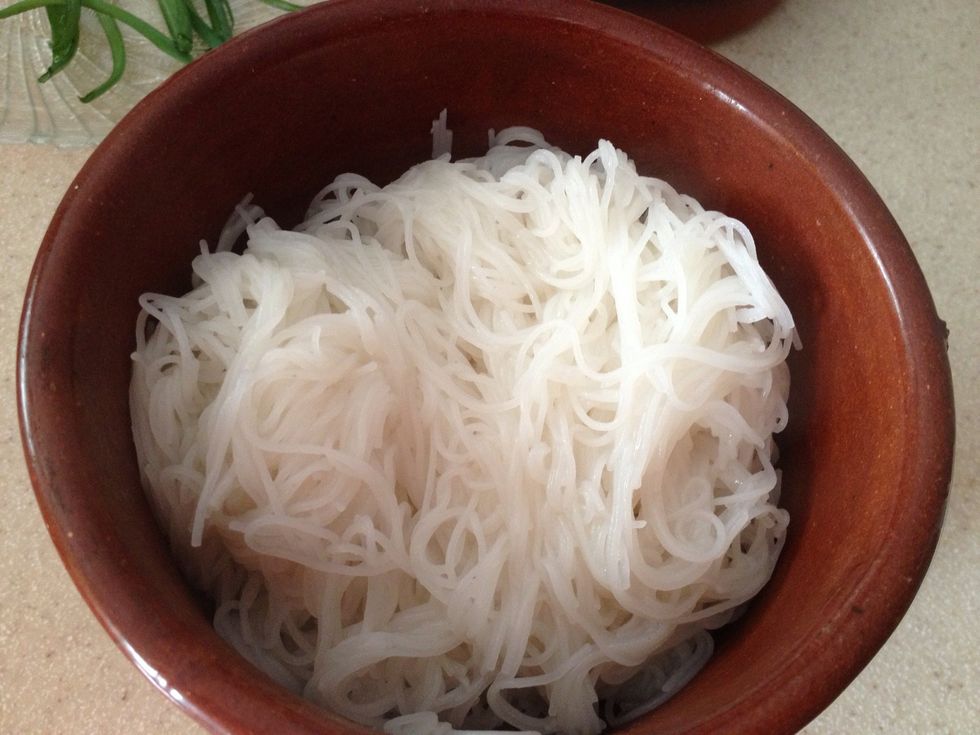 Cook the rice noodles as per package directions. Cut them to about 3" length. If you can't find rice noodles, any thin pasta will do.