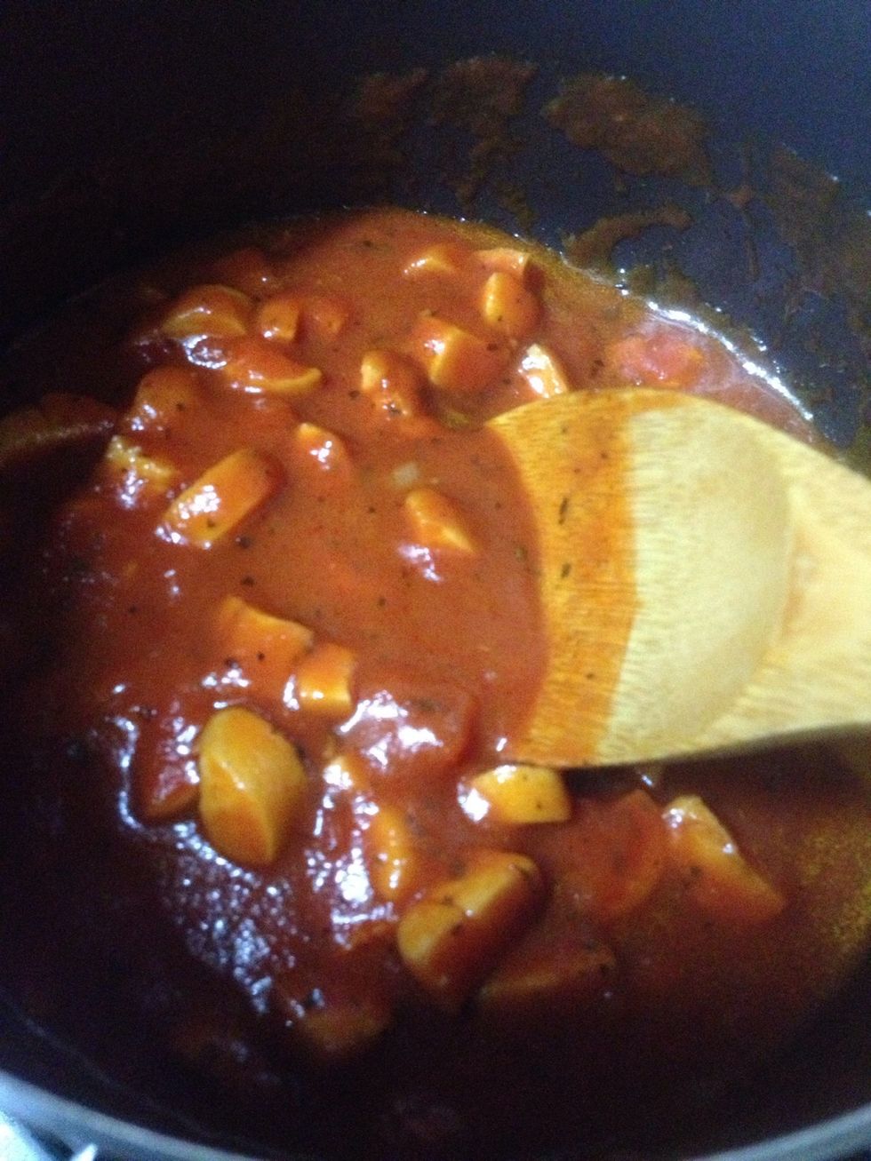 Cook the sausages with the tomato paste. Add water if you don't want the sauce to be thick. Optional to add other ingredients if desired (e.g. Minced onions, minced parsley, etc.)