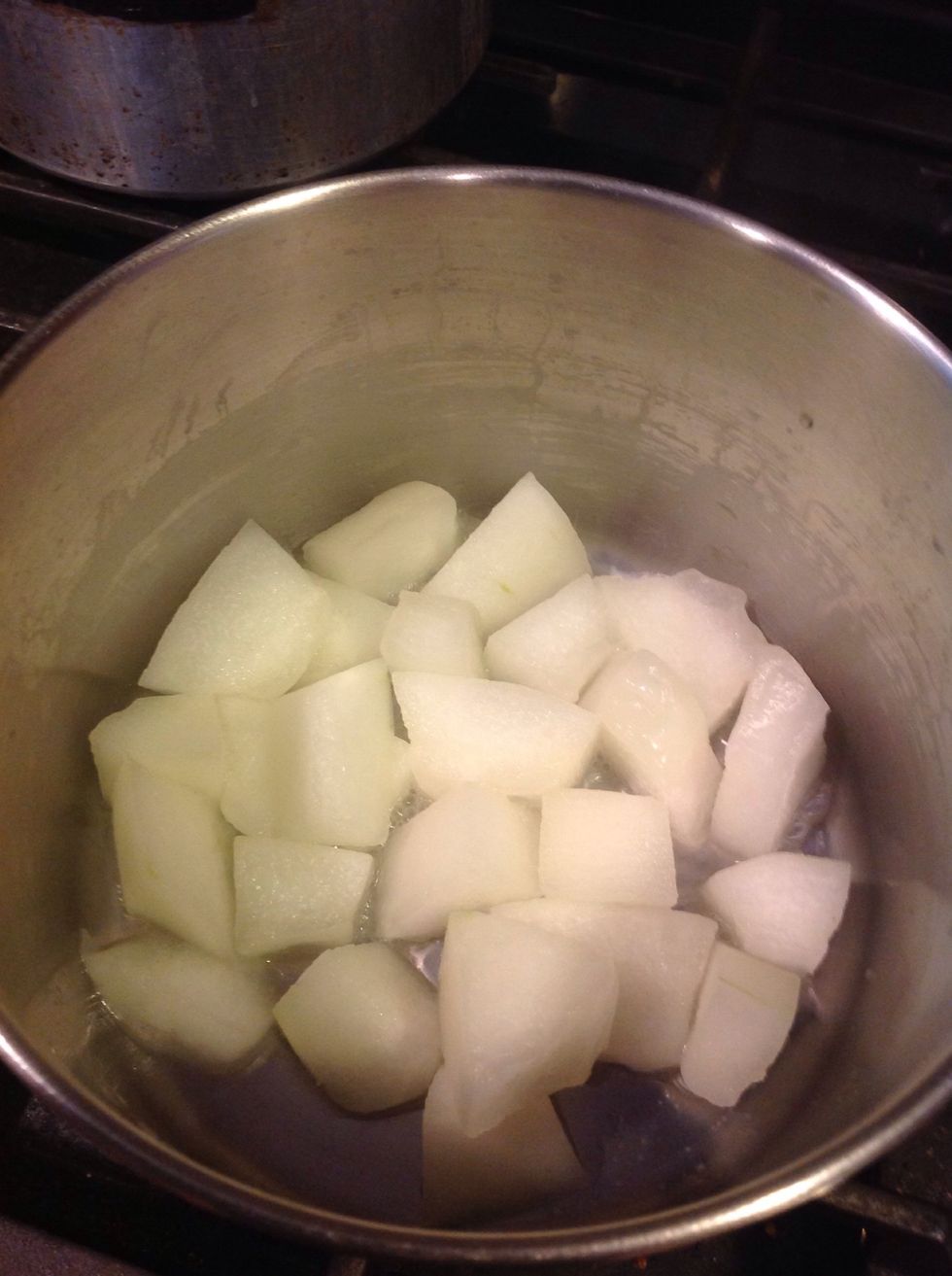 Cook the winter melon cubes in a covered vessel with very little water (5 tbsp). If u add too much water, the cubes will get squishy which u don't want. Keep stirring till it is tender.
