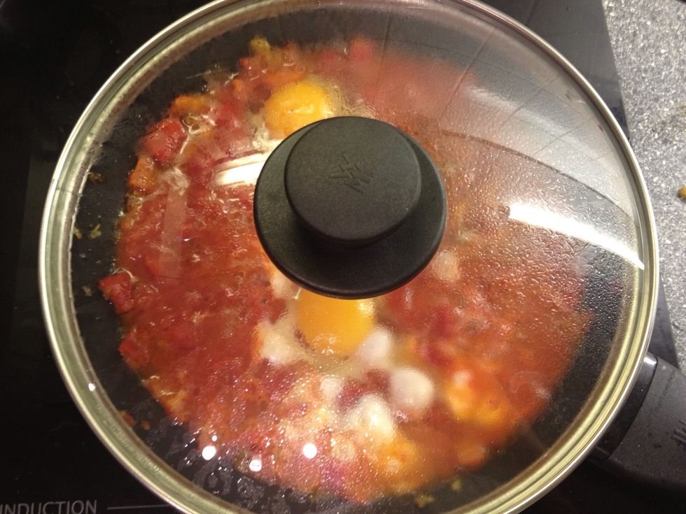 Cook to your liking. I prefer eggs runny and serve when all clear has turned into white. Eggs will keep cooking for a bit given the temperature of the sauce.