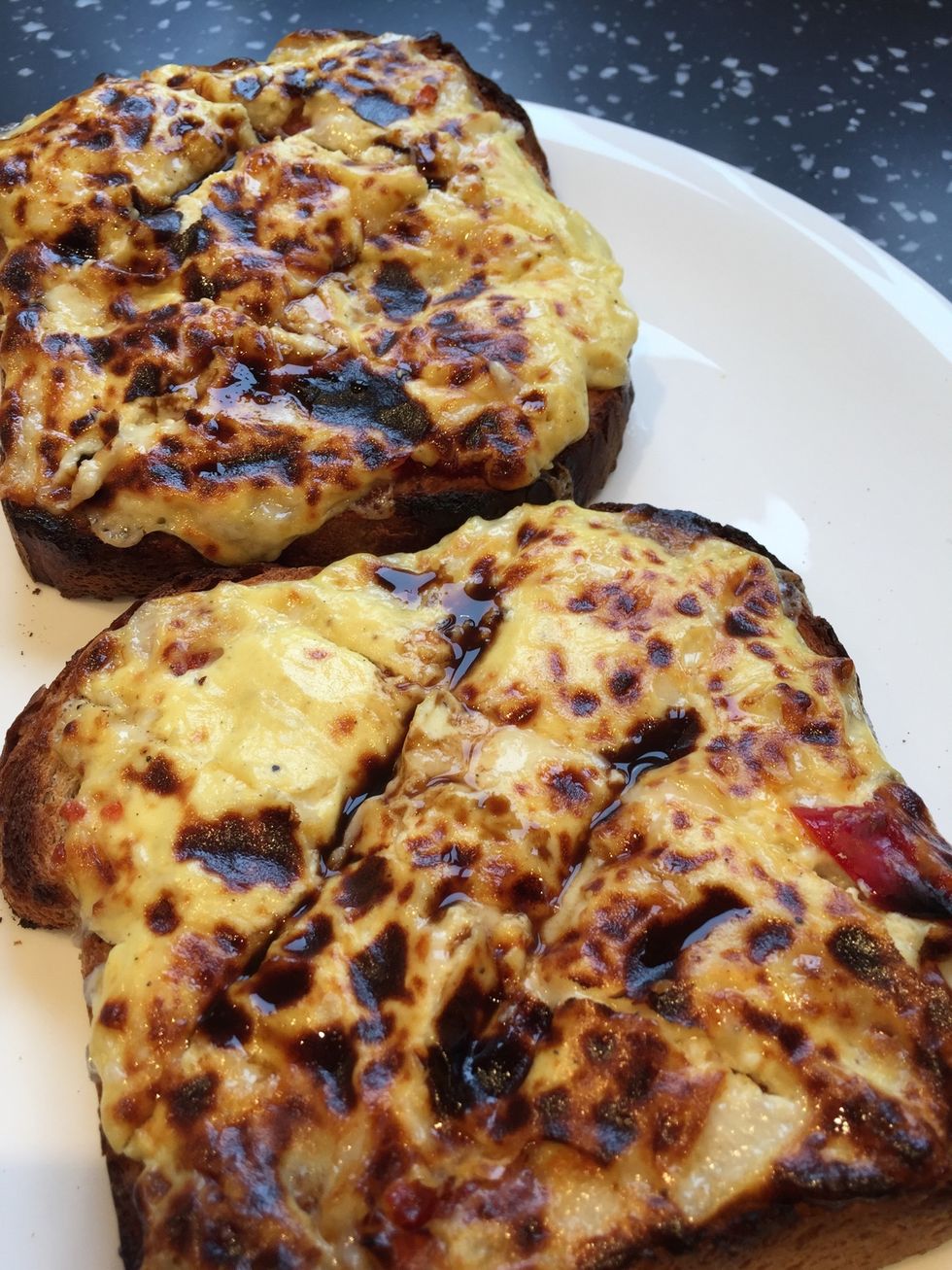 Cook under a pre heated hot grill until it starts to bubble