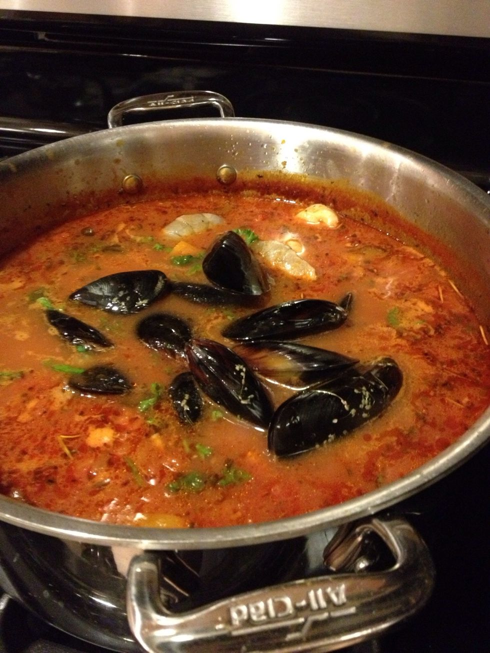 Cook until shells open, discard any shells that don't open.