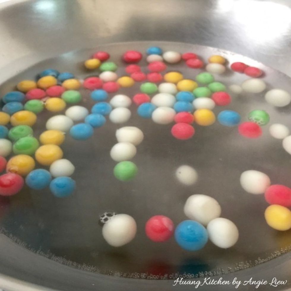 Cook until they float to the surface. Once all the rice balls have risen to the surface, allow to cook for another 1 minute.