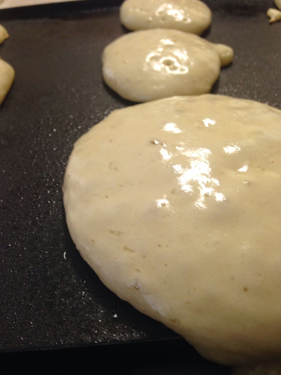 Cook until they start to bubble. Flip over with spatula, and cook on other side until brown:)