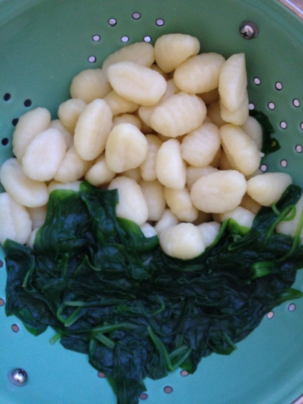 Cook your gnocchi and spinach separately, then drain. This takes approx 5mins. Boil the gnocchi in water with a splash of olive oil and the spinach in salted water.