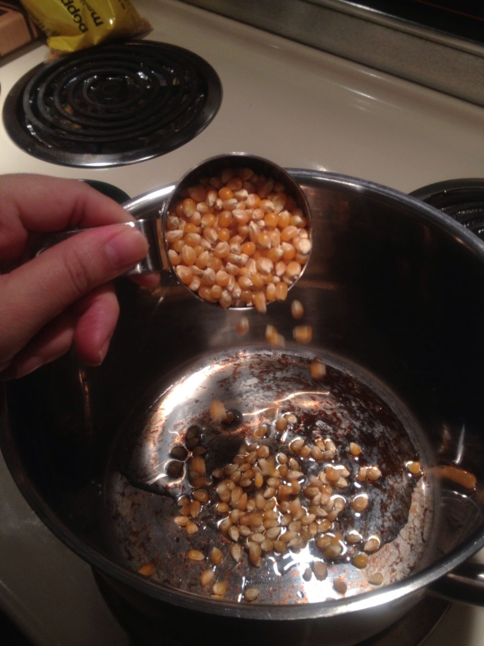 Cook your popcorn. My method: a splash of oil. 1/2 cup of kernels. Medium heat.