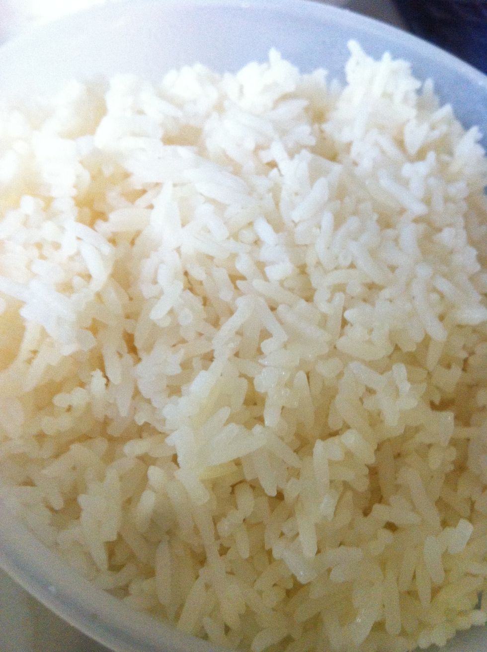 Cooked rice. You better cook it and put it in the fridge a night before to avoid the rice being sticky when you fried it with the wok.