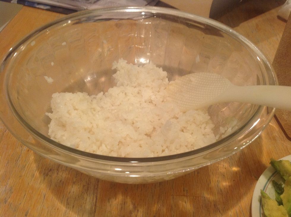 Cooked sushi rice with the mirin and rice vinegar mixed in