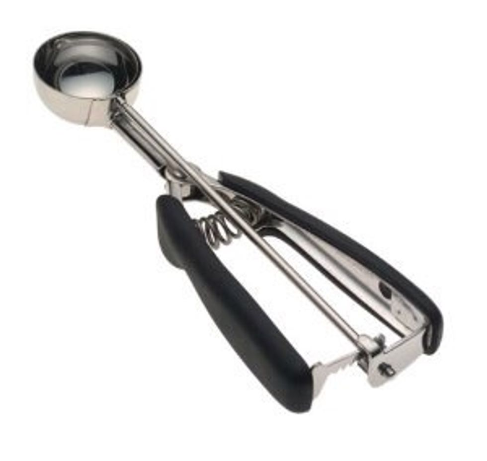 Cookie Scooper. Used to scoop evenly sized balls of dough. I can use a cookie scooper to make cookies.