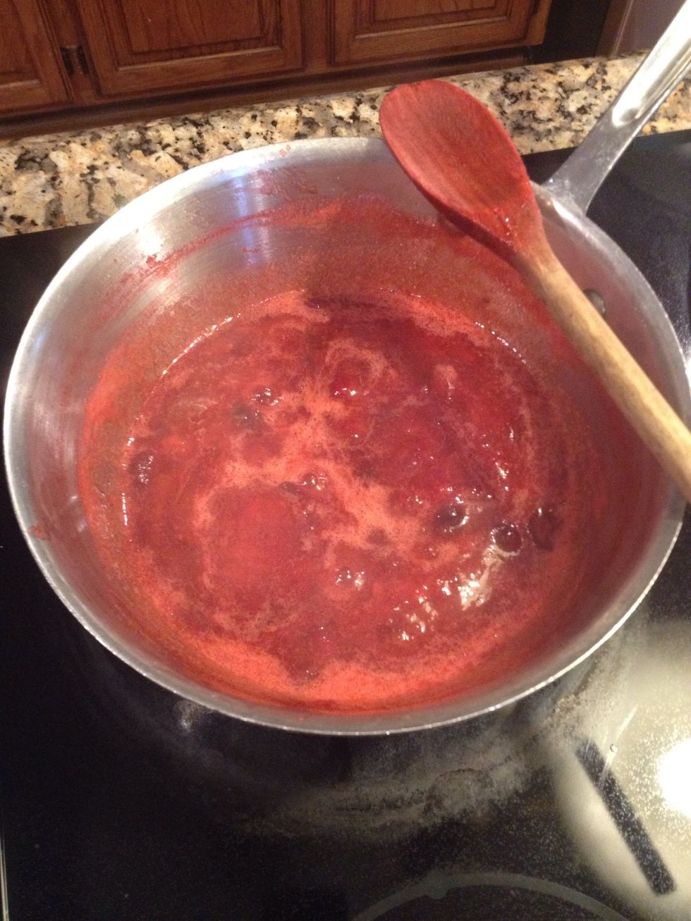 Cooking breaks down the fruit so there isnt a need to break it up with a spoon however it will start to settle on the bottom of cooker, so be sure to rembr to stir during the 45 min cook time