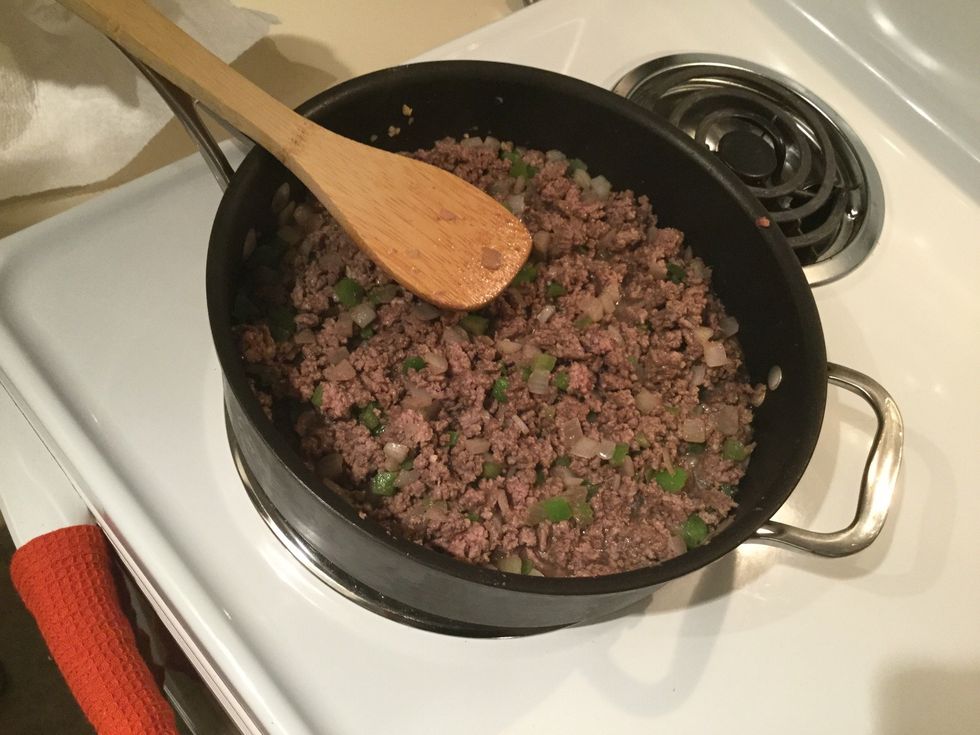 Cooking ground beef until brown
