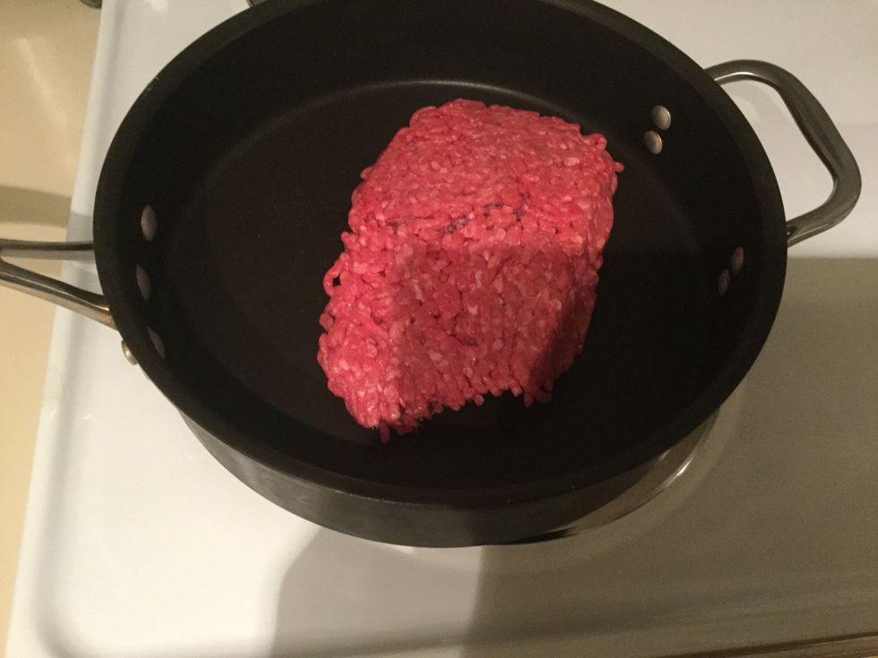 Cooking my ground beef, until brown.