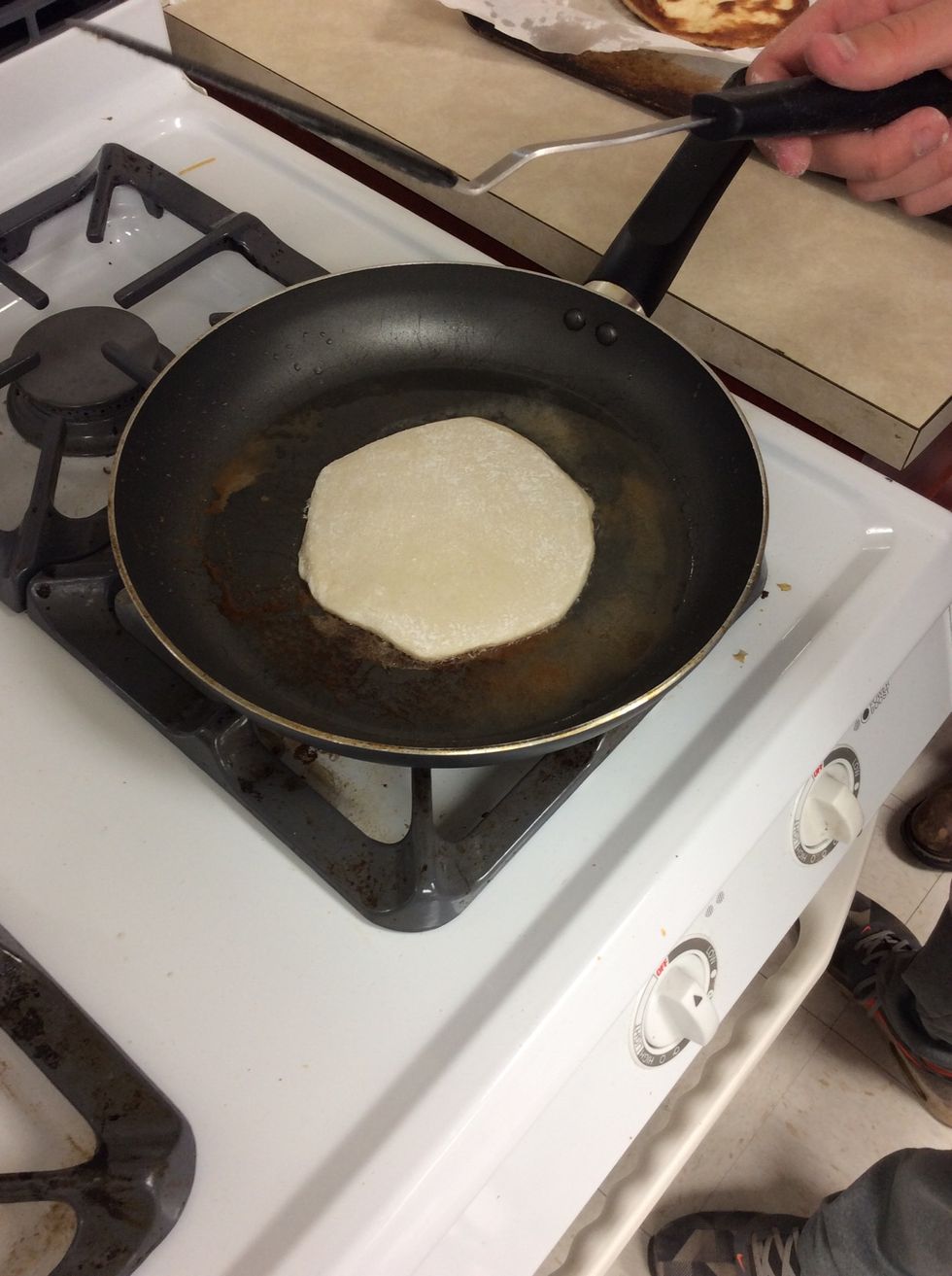 Cooking the biscuit shells on the skillet