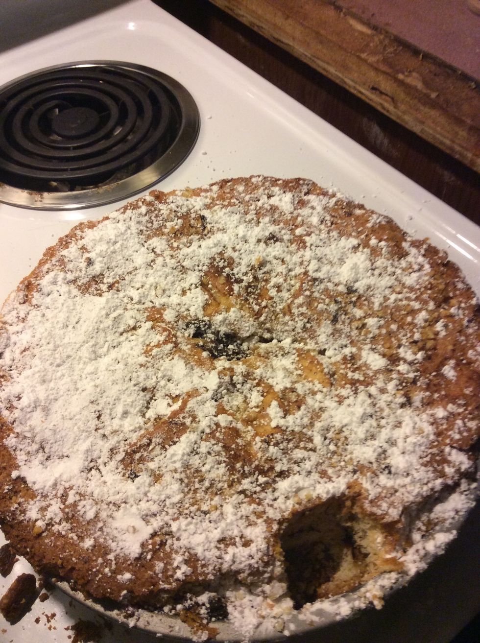 Cool in tin for 15 minutes, remove, transfer to a serving platter, and sprinkle with powdered sugar