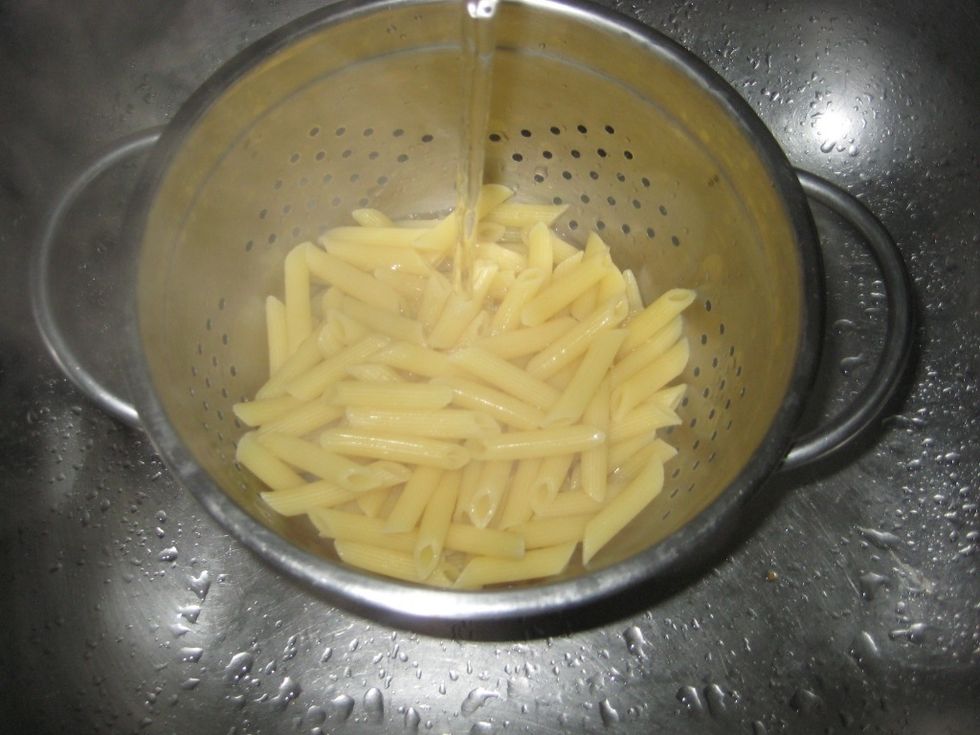 Cool the pasta under running water to stop the cooking process.