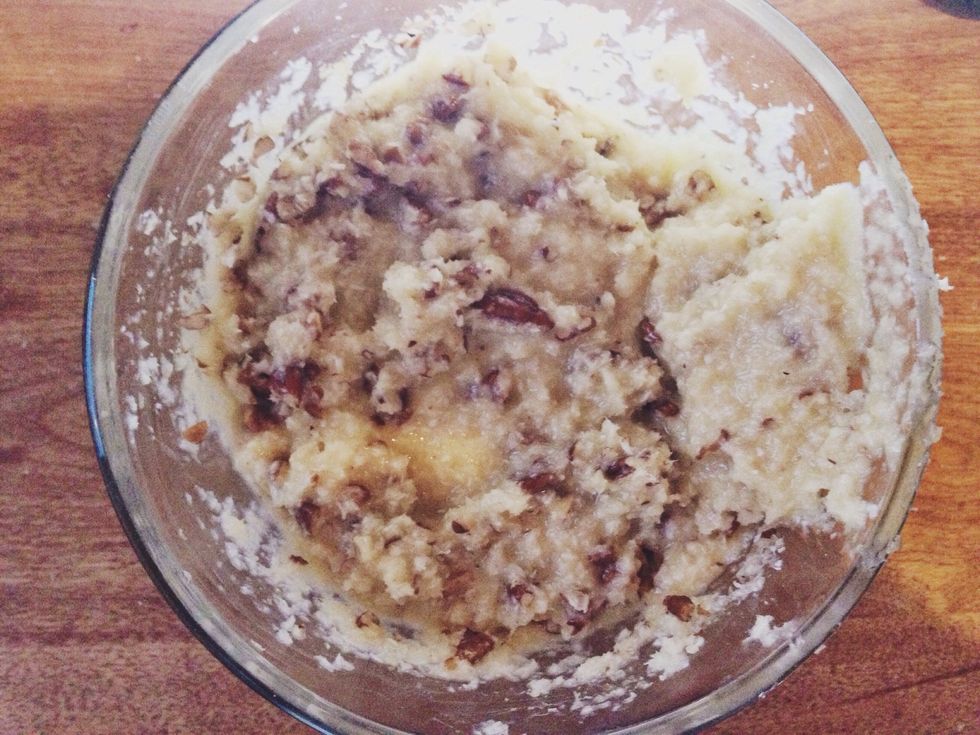 Cool to room temperature, and then stir in the coconut and pecans.