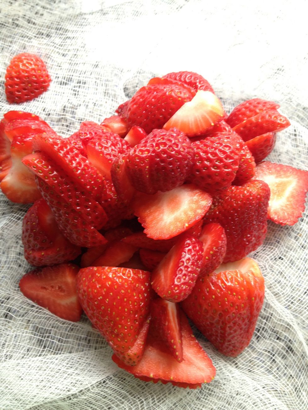 Core and slice strawberries.