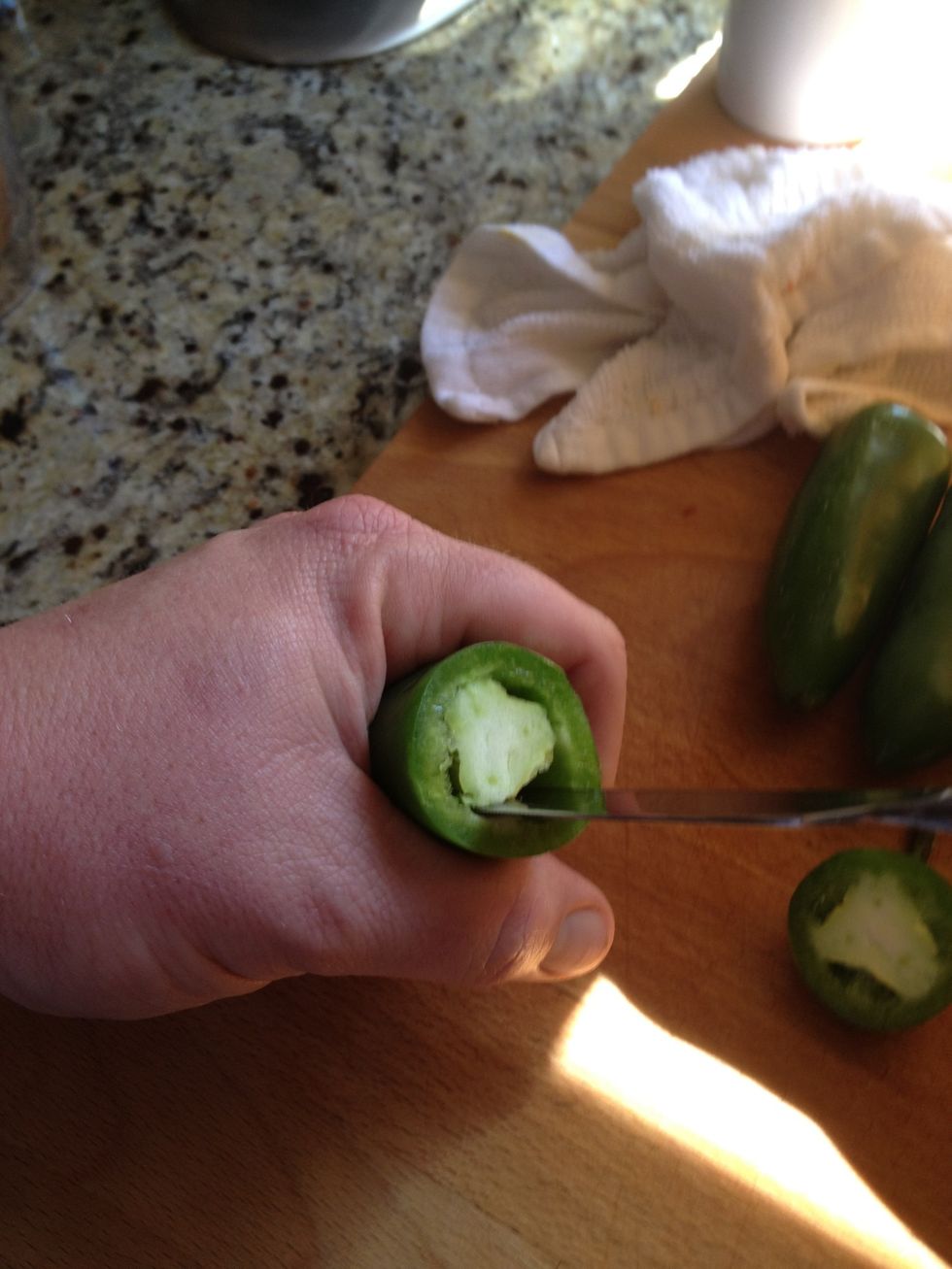 Core out the jalape\u00f1o using a butter knife to avoid cutting jalape\u00f1o edges.
