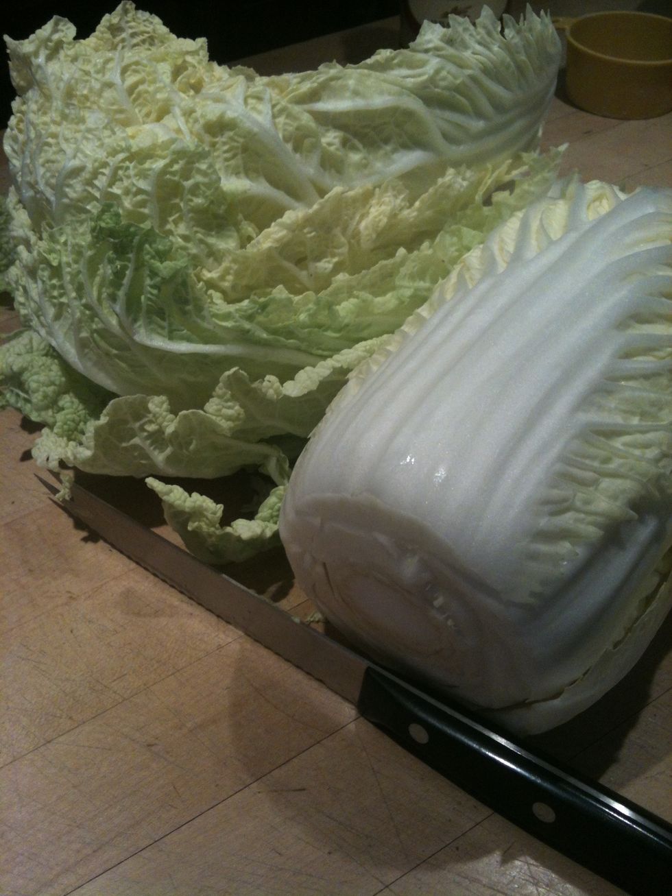 Core the cabbage and discard outer leaves, then cut the cabbage lengthwise into quarters.