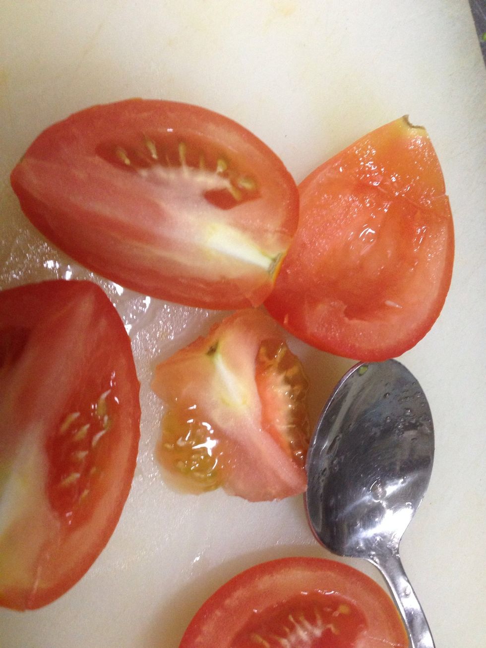 Core tomato and cut into quarter.