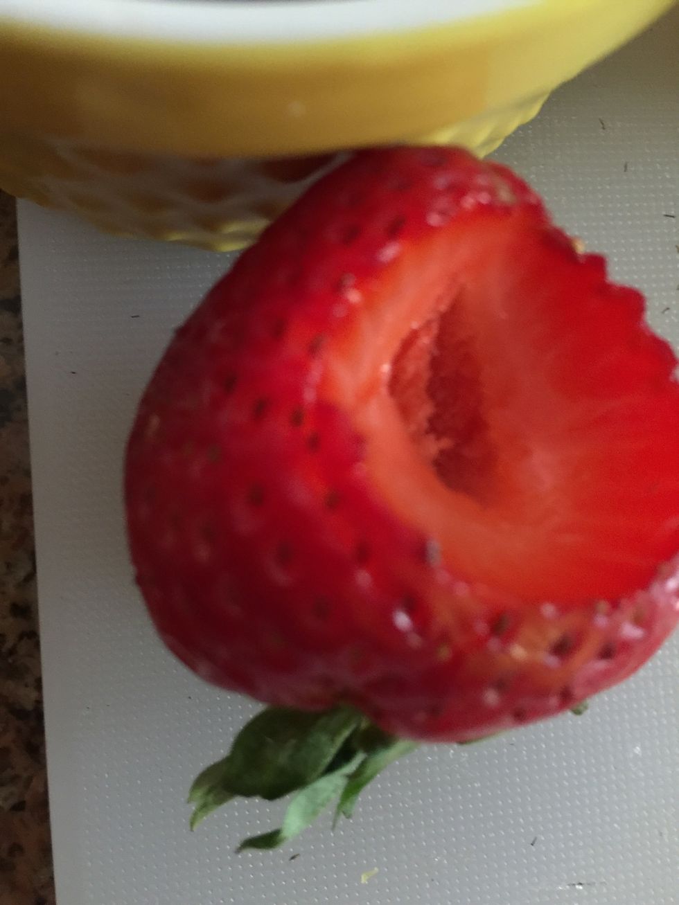Cork the middle of the strawberry