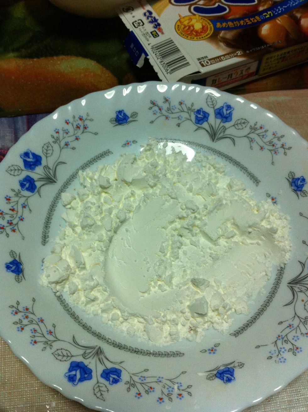 Corn flour! Dip the pork into the corn flour...