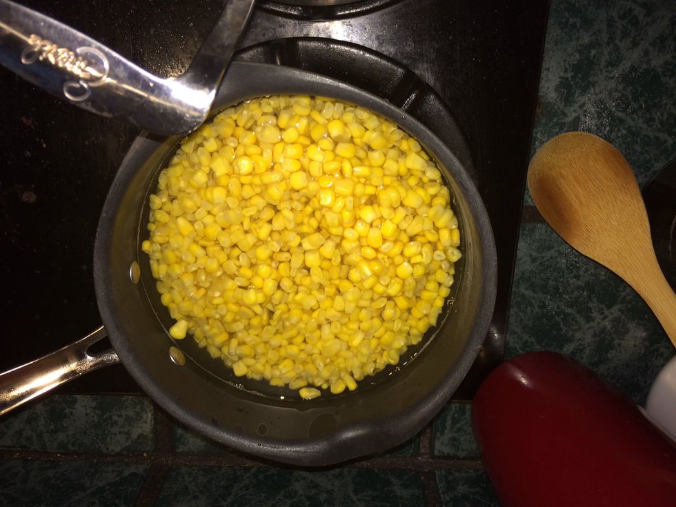 Corn with just enough water to cover and turned on low heat.