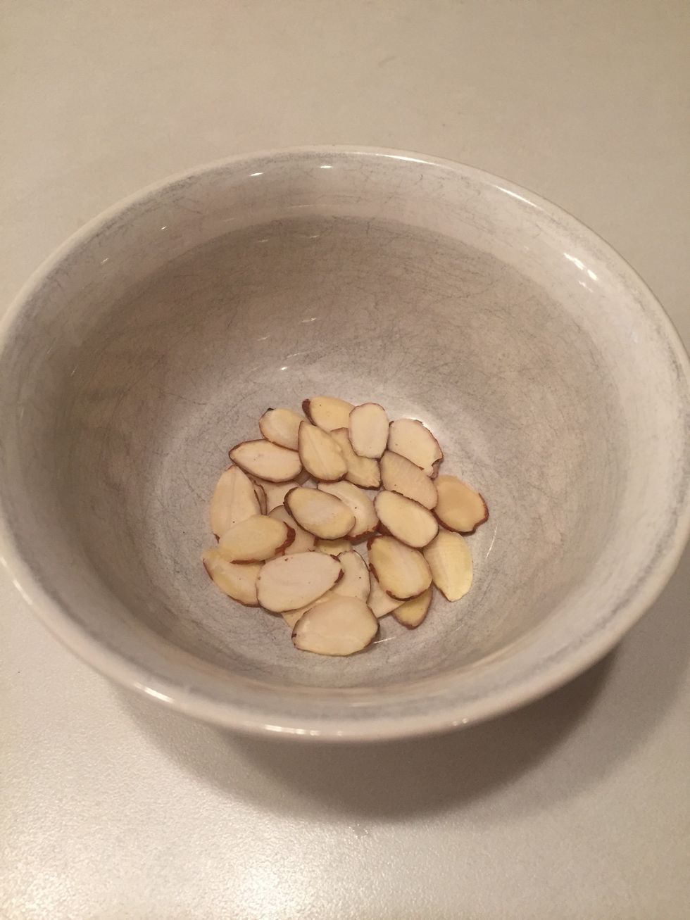 Count out 5 sliced almonds per cookie and set aside.