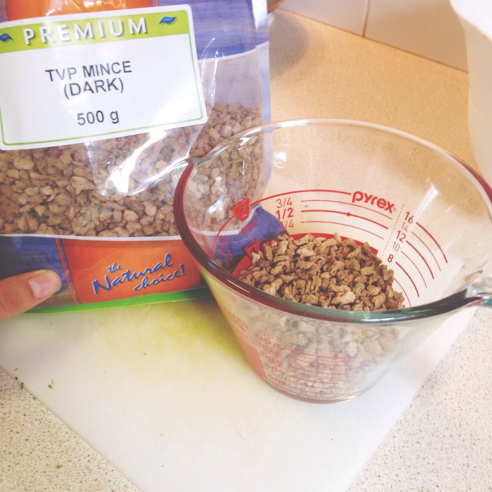 Cover 1 cup of TVP in hot water and allow to sit until hydrated (approximately 10 min). You can either skip this step, or replace it with any crumble-like veggie meat.  Just please, no tofu!