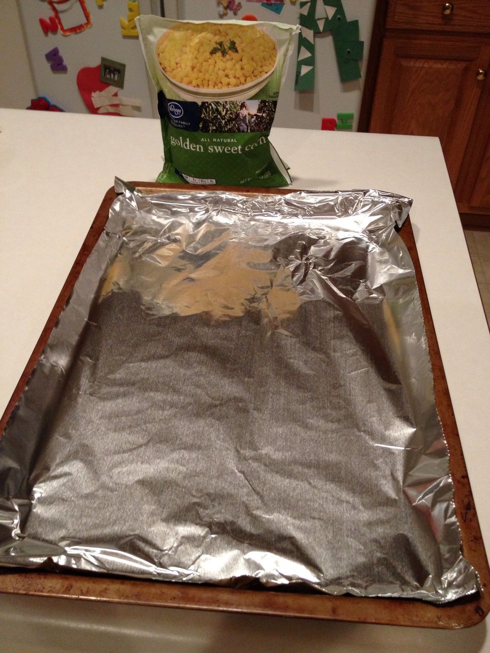 Cover a baking pan with aluminum foil.
