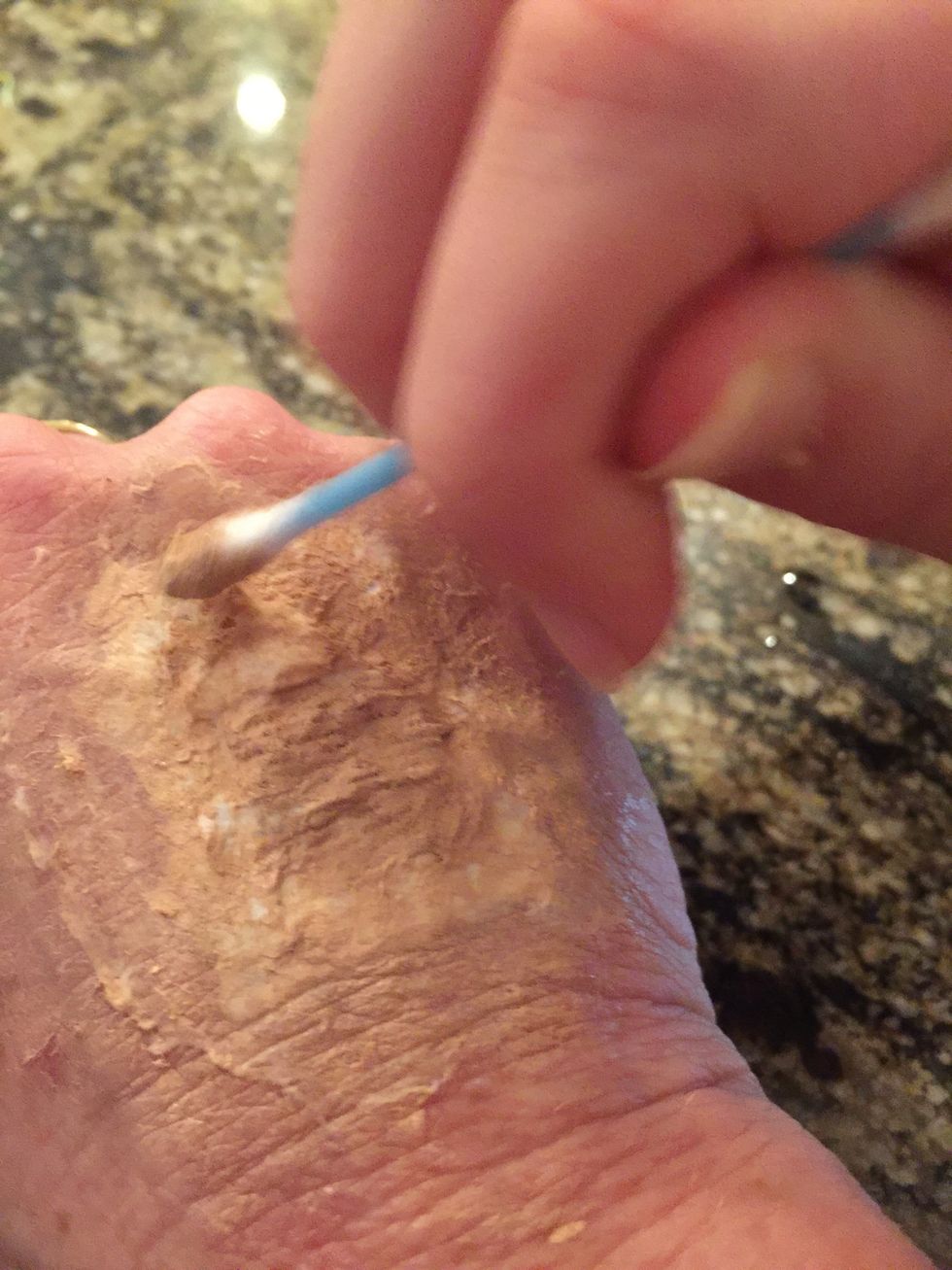 Cover all of the toilet paper. It is okay if it is rough looking, but make sure that there is very little, almost, no white showing.