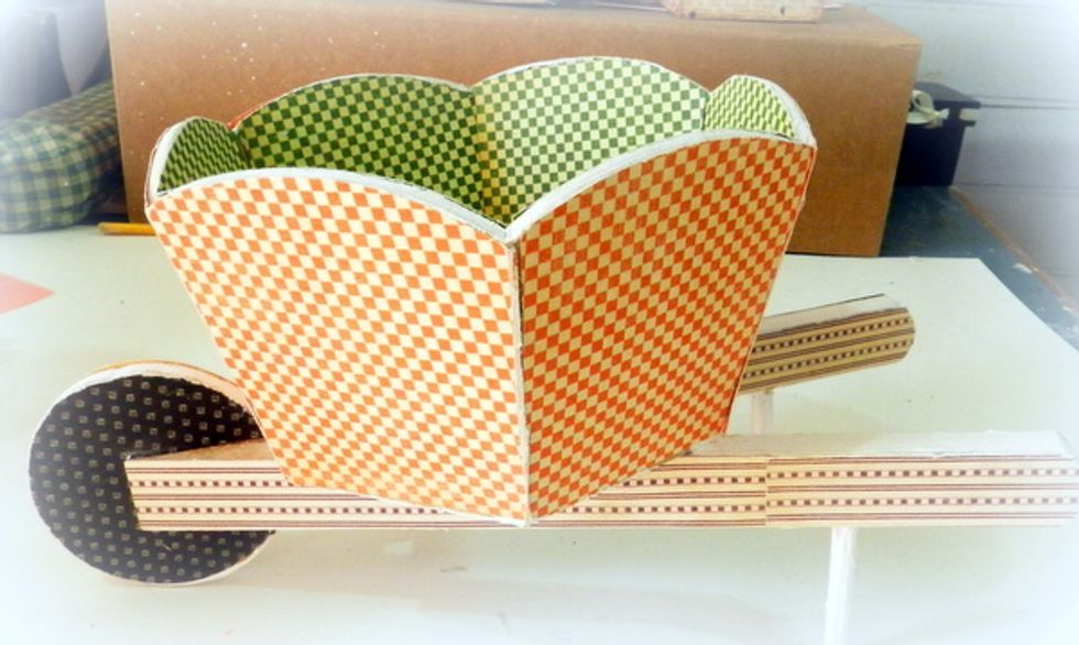 Cover all of the wooden wheelbarrow using G45 An Eerie Tale collection 6x6 papers.