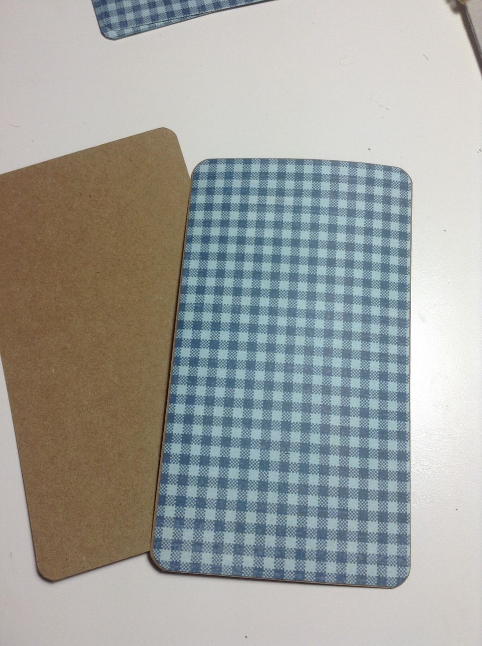 Cover all the kraft pages with patterned papers from By the Sea.