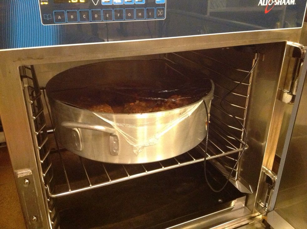 Cover and cook in a per heated alto-Shaam cook & hold oven. Probe one short rib. Cook at 250F (121C), set probe to 170F (77C), hold at 160F (71C).