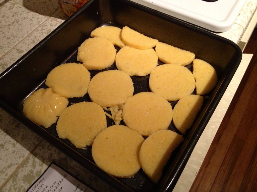 Cover bottom of casserole dish with a layer of polenta rounds.
