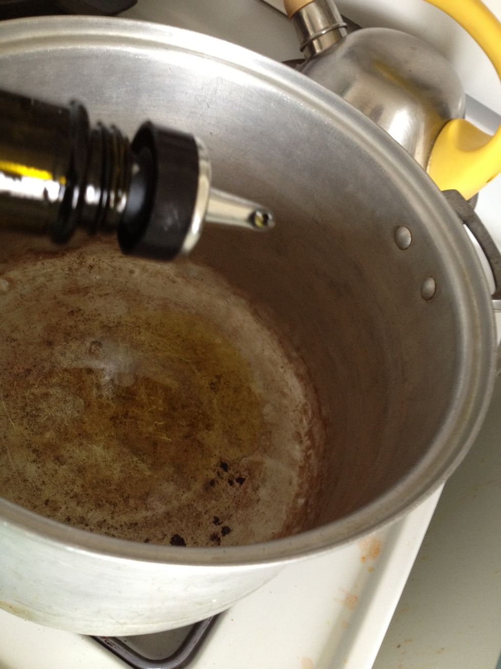 Cover bottom of pan with olive oil. Please ignore the stains - this pot has been used for 3 generations!