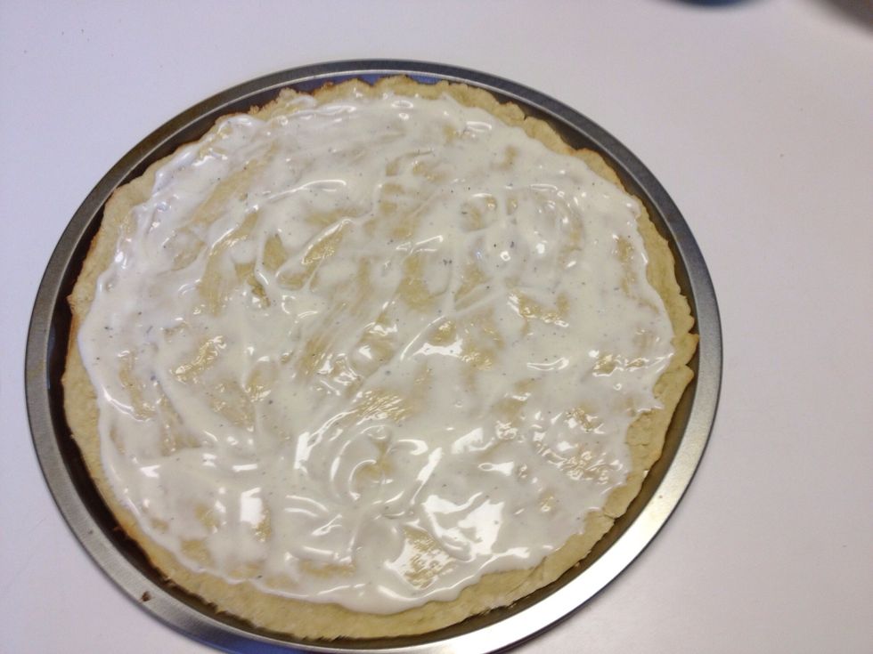 Cover crust with Ranch dressing enough for your desired taste.