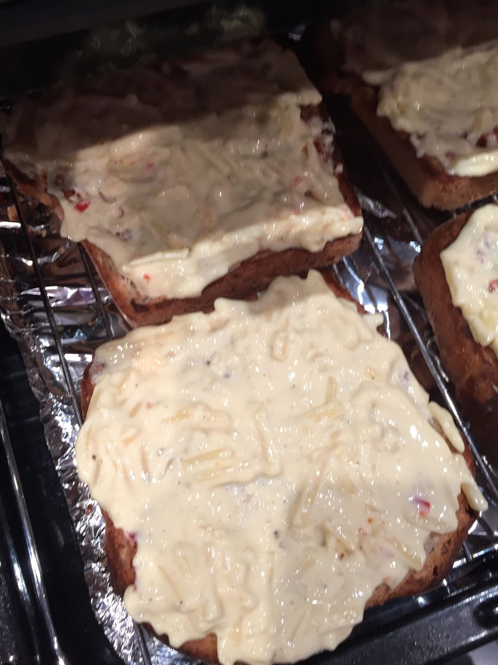 Cover each slice of bread with a quarter of the cheese mix