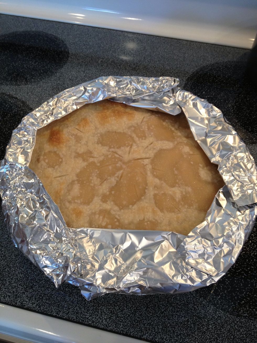 Cover edges with aluminum foil. Place pie back in the oven and bake for another 30-35 minutes until crust turns a golden brown.