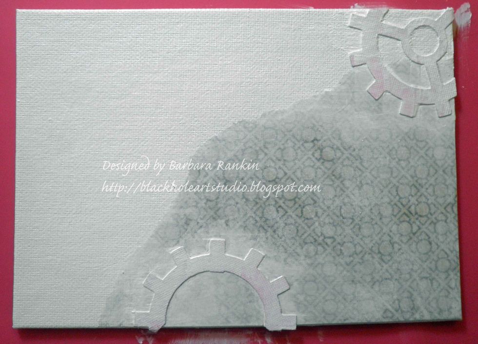 Cover entire canvas with light wash of white gesso.