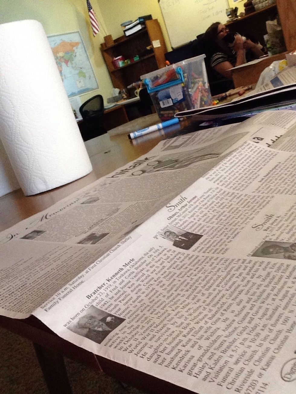 Cover flat surface with newspaper.