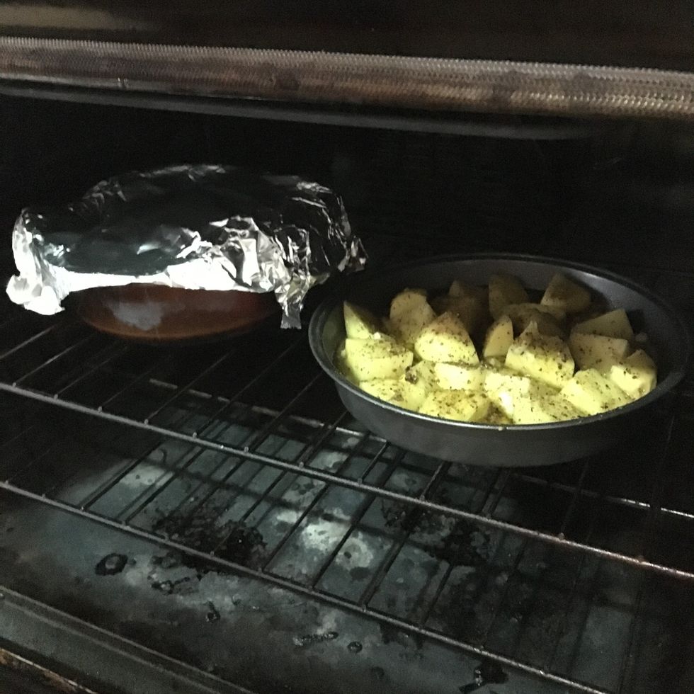 Cover ham in tinfoil then place the potatoes and ham in the oven. Let cook for an hour and 15 minutes. Baste ham every 10-15 minutes.