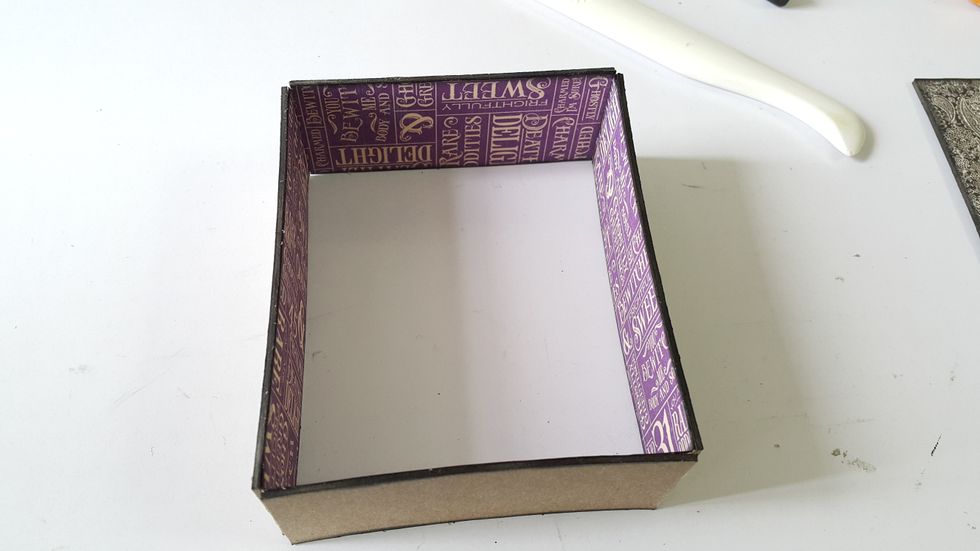 Cover in and out with pattern paper and apply Distress Ink on the edges