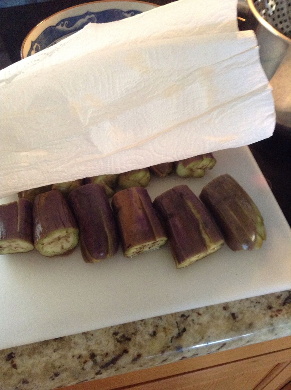 Cover in paper towel to soak water and let them cool for a bit until they're not too hot to touch.