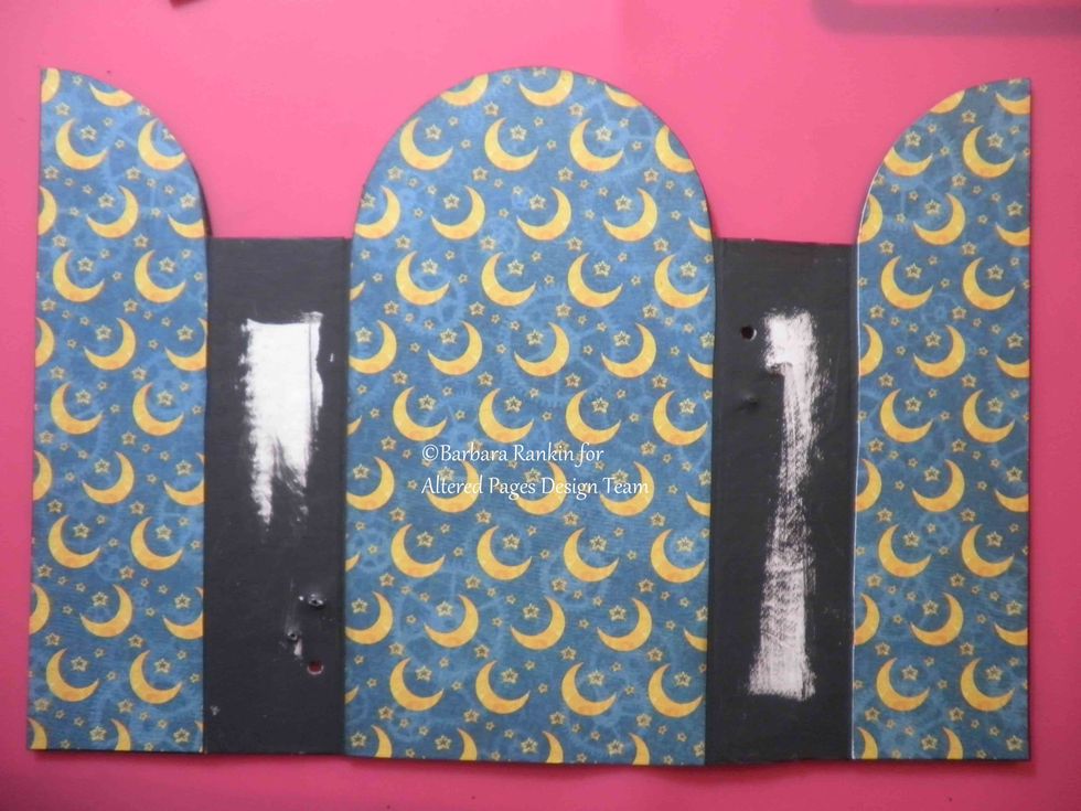 Cover inside center and door panels. Leave spine sections bare for now. Again, run papers through Xyron for easy, edge-to-edge adherence.