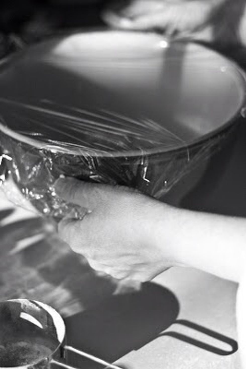 Cover it tightly with plastic wrap and set it in a warm place to rest for at least 12 hours.