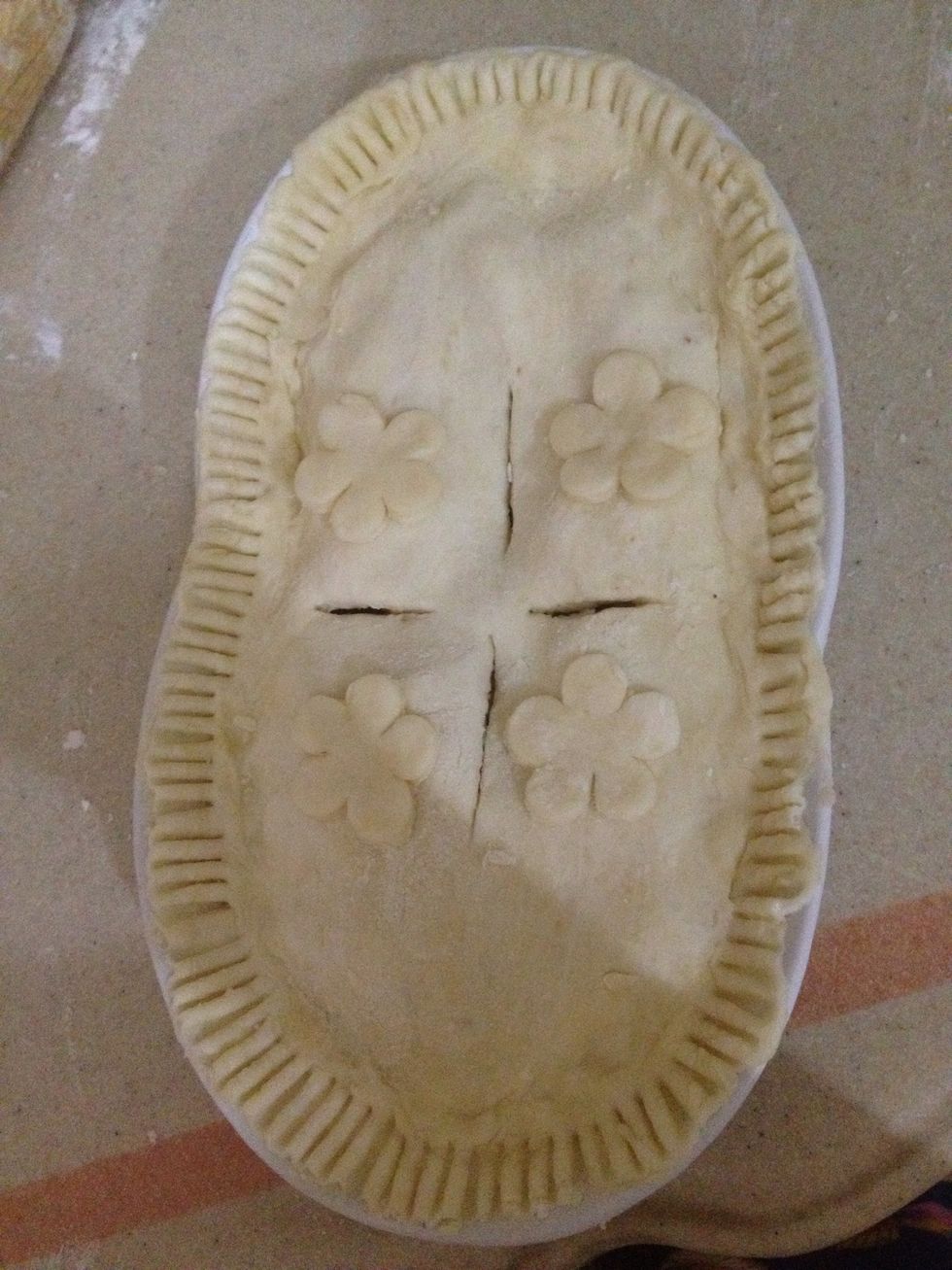 Cover it with the other half of the crust You can decorate the edges by using a fork