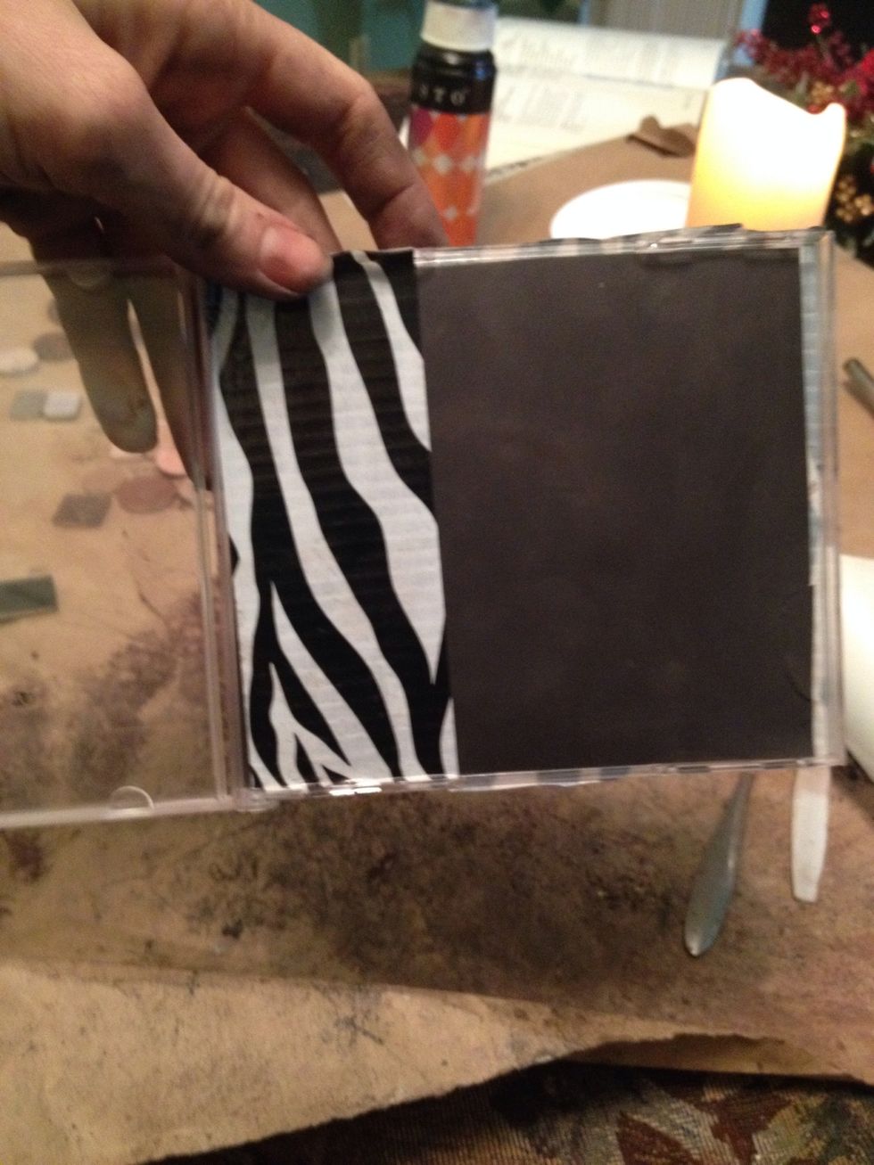 Cover magnet side and back side (and front if you wish) of CD case with duct tape.